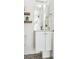 Small bathroom with floating vanity and patterned floor at 4060 W 16Th Ave, Denver, CO 80204