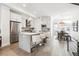 Modern open concept kitchen with island and stainless steel appliances at 4060 W 16Th Ave, Denver, CO 80204