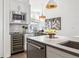 Modern kitchen features stainless steel appliances and wine cooler at 4060 W 16Th Ave, Denver, CO 80204
