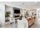Open living room, kitchen, and breakfast bar with modern fireplace at 4060 W 16Th Ave, Denver, CO 80204