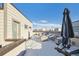 Rooftop deck with covered furniture and snow on the ground at 4060 W 16Th Ave, Denver, CO 80204