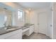 Double vanity bathroom with dark countertop and tile flooring at 241 Paloma Way, Elizabeth, CO 80107