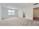 Spacious bedroom with carpet flooring and large window at 241 Paloma Way, Elizabeth, CO 80107