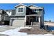 Two-story house with gray siding, attached garage, and small front yard at 241 Paloma Way, Elizabeth, CO 80107