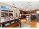 Sun-filled dining area with wood floors, a fireplace, and access to the kitchen and backyard at 8617 Gold Peak Dr # G, Highlands Ranch, CO 80130