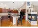 Beautiful kitchen with dark wood cabinets, a breakfast bar, and modern appliances at 8617 Gold Peak Dr # G, Highlands Ranch, CO 80130