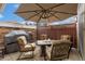 Outdoor patio with patio table, chairs, and grill; perfect for summer gatherings and cookouts at 8617 Gold Peak Dr # G, Highlands Ranch, CO 80130