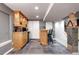Basement kitchenette with bar, stainless steel mini fridge and tiled floor at 3889 S Fraser St, Aurora, CO 80014