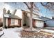 Charming two-story home with a brick and siding facade, attached two-car garage, and mature landscaping at 3889 S Fraser St, Aurora, CO 80014