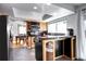 Well-appointed kitchen with granite counters, modern appliances, and an eat-in breakfast bar at 3889 S Fraser St, Aurora, CO 80014