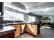 Open kitchen with granite counters and stainless steel appliances flowing into adjacent living area at 3889 S Fraser St, Aurora, CO 80014