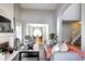 Spacious living room with fireplace, open to dining room, perfect for entertaining guests at 3889 S Fraser St, Aurora, CO 80014