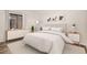 Light-filled bedroom with minimalist decor, neutral tones, and sliding glass doors at 2685 S Dayton Way # 234, Denver, CO 80231
