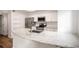 Kitchen island with marble countertop, stainless sink and appliances in modern kitchen at 2685 S Dayton Way # 234, Denver, CO 80231