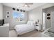 Bright secondary bedroom with a window offering community views and a closet at 9342 Bear River St, Littleton, CO 80125