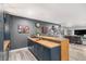Modern kitchenette featuring navy cabinetry, butcher block countertops, stylish fixtures and decor at 9342 Bear River St, Littleton, CO 80125