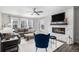 Cozy living room features a fireplace, large windows, and comfortable seating at 9342 Bear River St, Littleton, CO 80125
