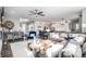 Open-concept living space featuring a fireplace, a kitchen, and comfortable seating at 9342 Bear River St, Littleton, CO 80125