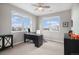 Home office with large windows offering community views, neutral walls, and plenty of space at 9342 Bear River St, Littleton, CO 80125