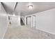 Spacious basement area with carpeted floors, ample lighting, and versatile layout options at 7831 Hollywood St, Commerce City, CO 80022
