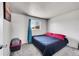 Cozy bedroom with a large bed, soft carpeting, and a window for natural light at 7831 Hollywood St, Commerce City, CO 80022