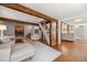 Spacious living room connects seamlessly to the kitchen, featuring hardwood floors and neutral decor at 10179 S Turkey Creek Rd, Morrison, CO 80465