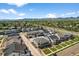 A bird's-eye view of a residential neighborhood with well-maintained homes and lush landscaping, with mountains in the background at 4581 S Kipling Cir, Denver, CO 80123