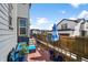 Cozy backyard patio with blue outdoor seating, stone flooring, and a privacy fence, perfect for relaxation at 4581 S Kipling Cir, Denver, CO 80123
