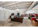 Unfinished basement space with exposed ceiling and concrete floor, with seating area for potential customization at 4581 S Kipling Cir, Denver, CO 80123