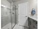 Bathroom featuring glass-enclosed shower and modern fixtures at 4581 S Kipling Cir, Denver, CO 80123
