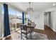 Cozy dining area featuring a modern chandelier and a sliding glass door at 4581 S Kipling Cir, Denver, CO 80123