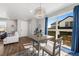 Dining area with modern chandelier and sliding glass doors to the exterior at 4581 S Kipling Cir, Denver, CO 80123