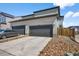 Attached two car garage with a long driveway at 4581 S Kipling Cir, Denver, CO 80123