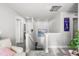 Bright hallway with carpet and a glimpse of multiple rooms and a staircase at 4581 S Kipling Cir, Denver, CO 80123