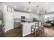 Modern kitchen featuring a quartz island, stainless steel appliances, and stylish pendant lighting at 4581 S Kipling Cir, Denver, CO 80123