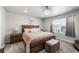 Spacious main bedroom featuring a decorative ceiling fan, carpet, and large bed at 4581 S Kipling Cir, Denver, CO 80123