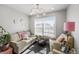 Sitting room featuring cozy furniture, natural light, and stylish decor at 4581 S Kipling Cir, Denver, CO 80123