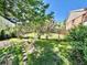 The backyard has healthy green grass and a decorative wooden lattice fence at 3531 E 91St Ave, Thornton, CO 80229