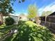 This lush backyard is fenced in for privacy and features a metal planter at 3531 E 91St Ave, Thornton, CO 80229