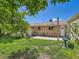 This backyard features a brick house, patio, shed, and a birdbath at 3531 E 91St Ave, Thornton, CO 80229