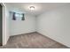 Finished basement room with carpet floors, a neutral wall color, and natural light at 3531 E 91St Ave, Thornton, CO 80229