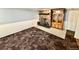 Finished basement with stone fireplace and built-in display cabinet at 3531 E 91St Ave, Thornton, CO 80229
