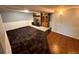 Finished basement with stone fireplace, cabinet and mixed flooring at 3531 E 91St Ave, Thornton, CO 80229