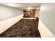 Finished basement with stone fireplace and built-in display cabinet at 3531 E 91St Ave, Thornton, CO 80229