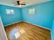 Bright bedroom featuring hardwood floors, natural light and a ceiling fan at 3531 E 91St Ave, Thornton, CO 80229
