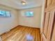 Cozy bedroom with hardwood floors and natural light from two windows at 3531 E 91St Ave, Thornton, CO 80229