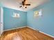 An unfurnished blue bedroom with hardwood floors, a ceiling fan and natural light at 3531 E 91St Ave, Thornton, CO 80229