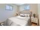 A serene bedroom with a tufted headboard and neutral color scheme at 3531 E 91St Ave, Thornton, CO 80229