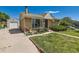Quaint single-story home with a detached garage, a well-kept lawn, and mature landscaping at 3531 E 91St Ave, Thornton, CO 80229