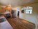 Open kitchen with stainless steel appliances and seamless flow to living area at 3531 E 91St Ave, Thornton, CO 80229